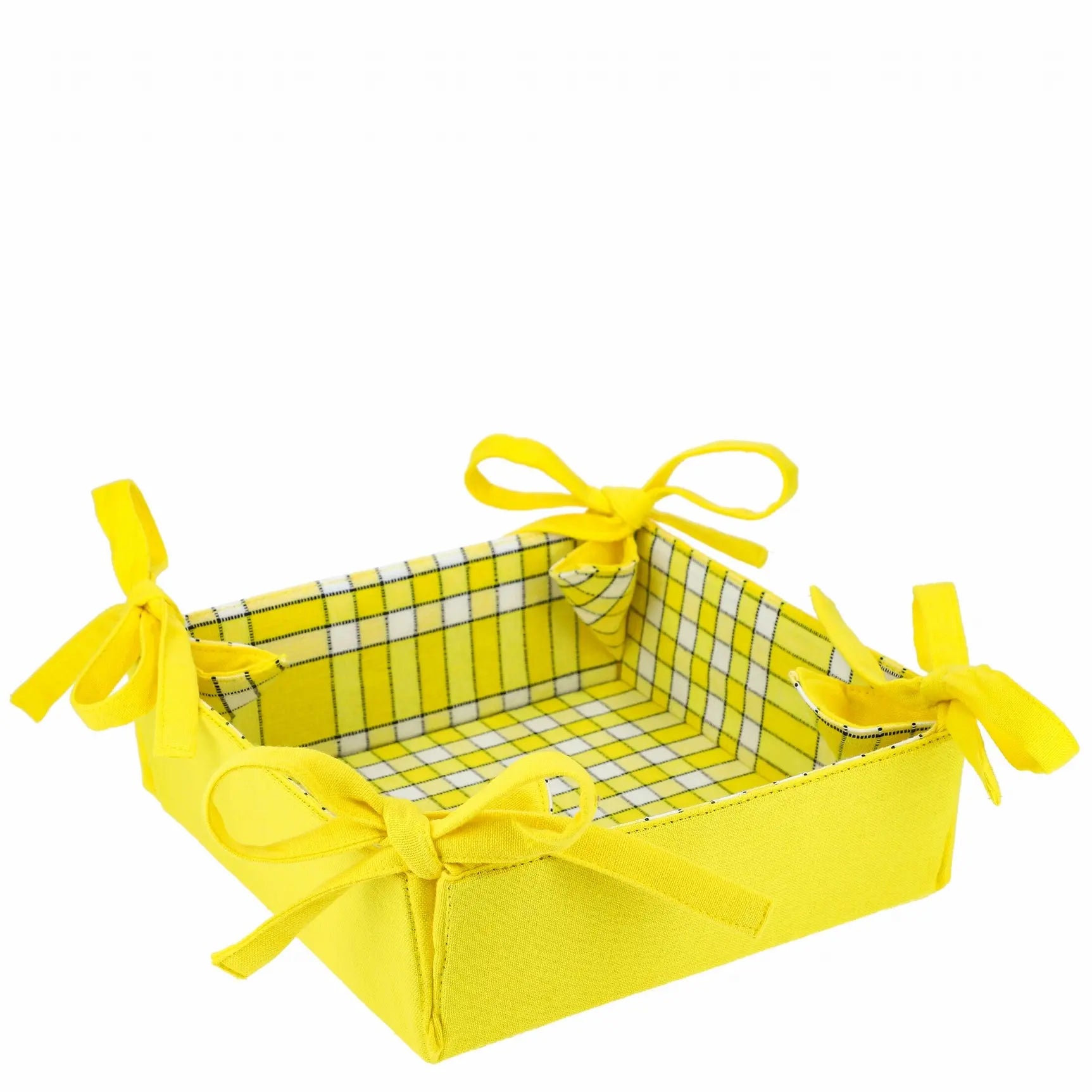 Corbeille à pain en tissu jaune à carreaux, réversible, avec nœuds. Idéale pour présenter pain, fruits ou œufs.
