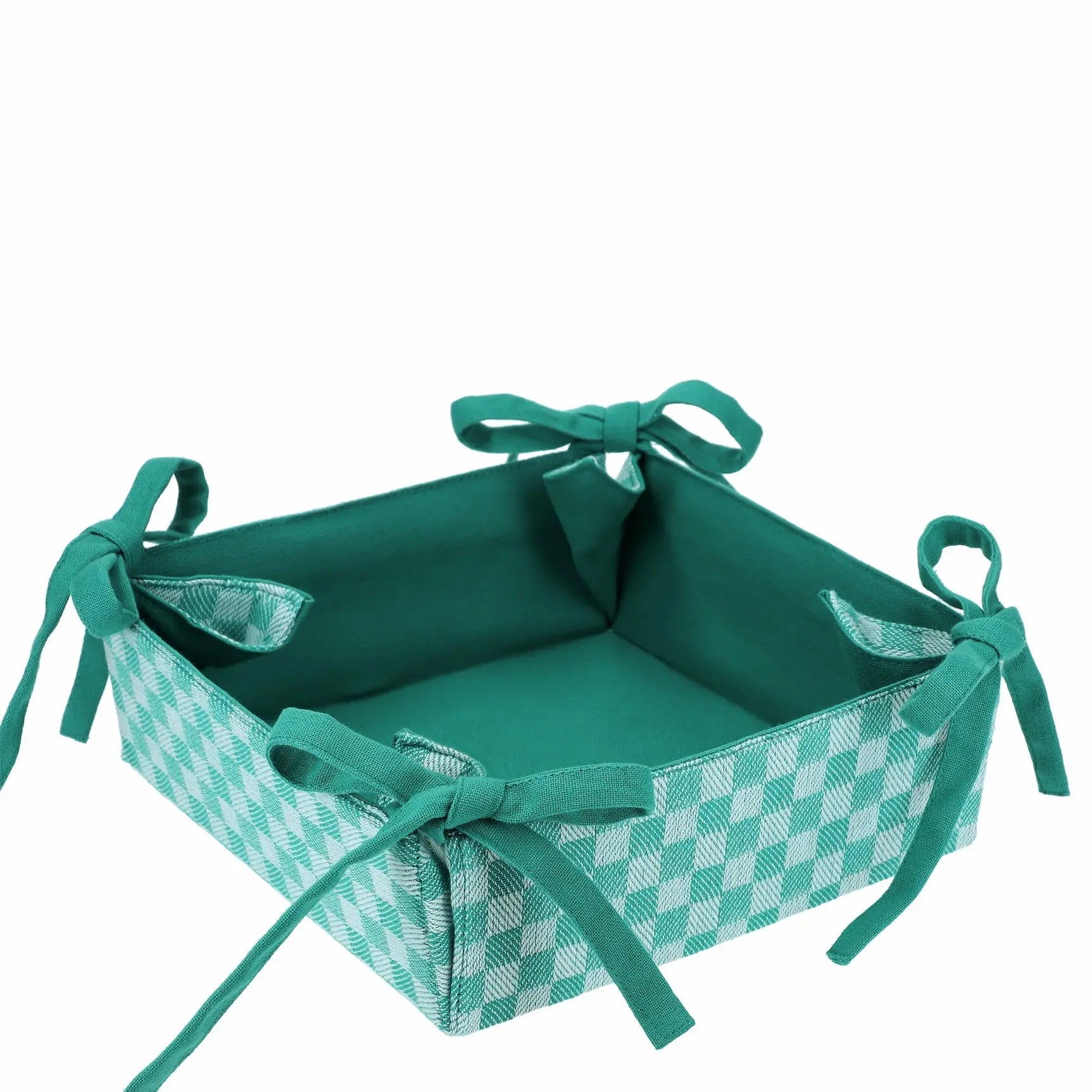 Corbeille en tissu à damier vert réversible avec noeuds, idéale pour pain, fruits et œufs. Élégance et polyvalence pour la table.