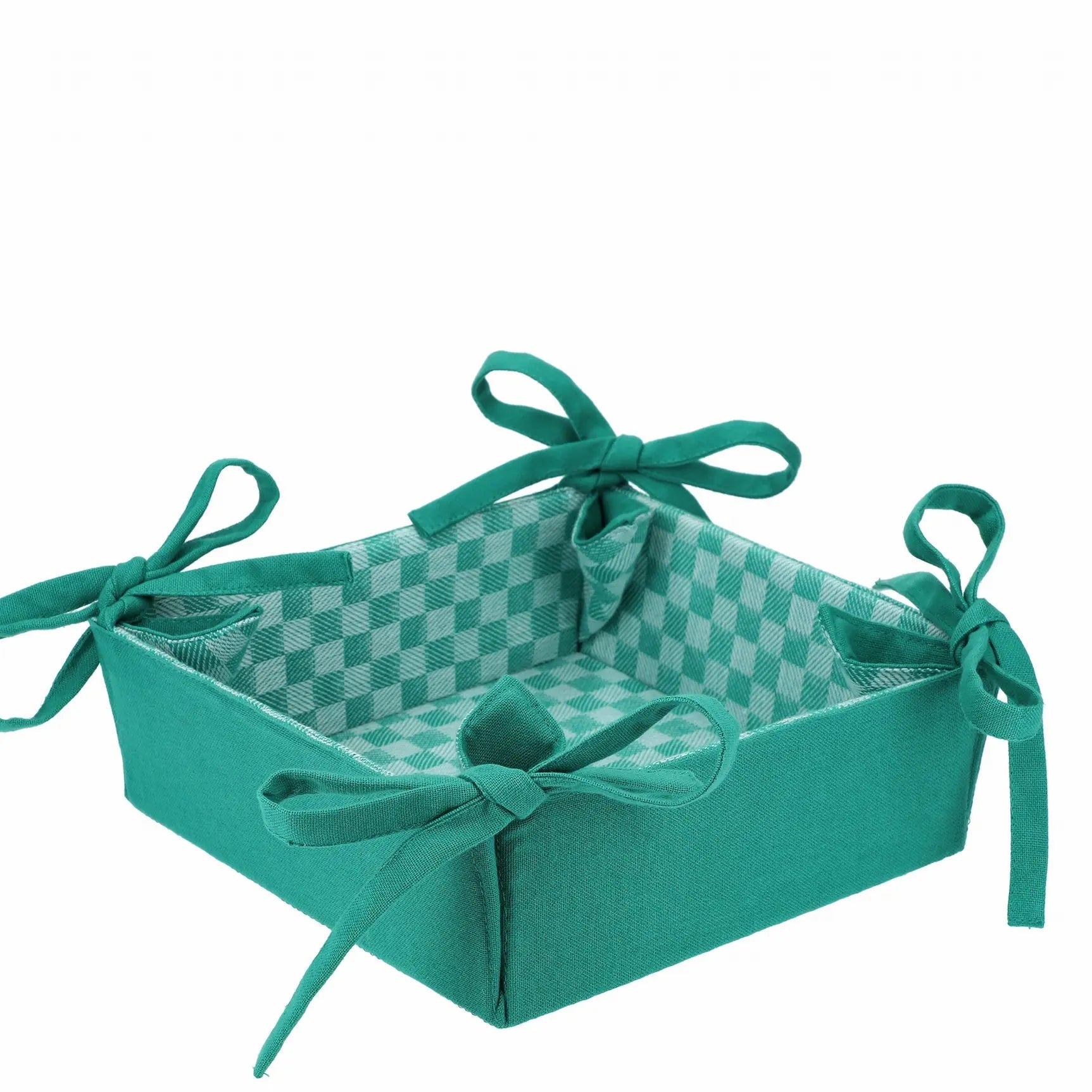 Corbeille en tissu à damier réversible verte, idéale pour présenter pain et fruits, ajoutant charme et élégance à votre table.