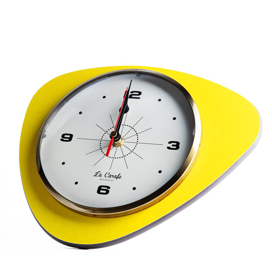 Horloge de cuisine originale jaune, design moderne pour une gestion efficace du temps en cuisine.