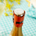 Le Bouchon à Champagne Conservation Effervescence en acier inoxydable et silicone, style vintage rétro années 50-70.